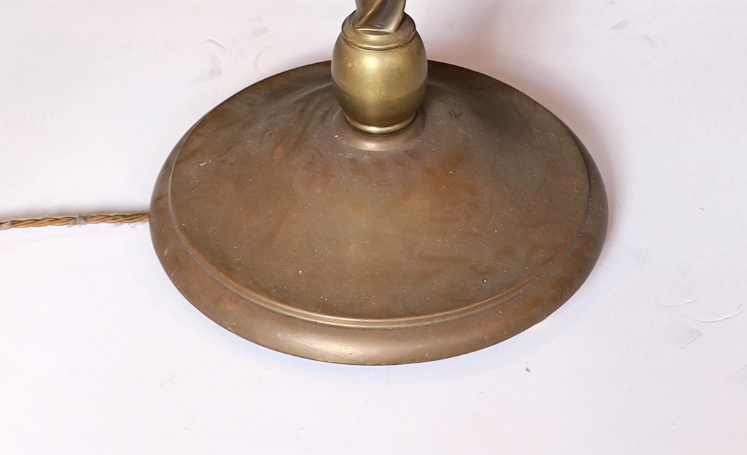 A lacquered brass three light lamp standard, with spiral fluted column and simulated candlestick sconces, height 172cm